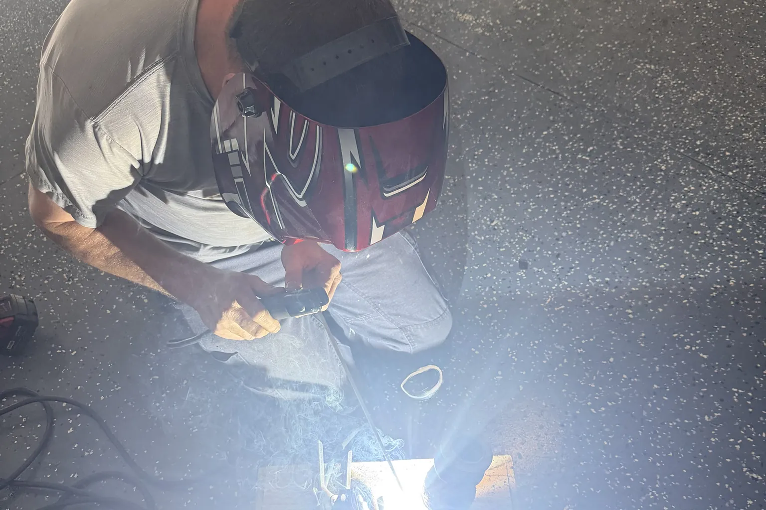 Tony stick welding in the workshop
